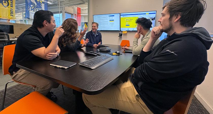 A development team collaborating in a meeting